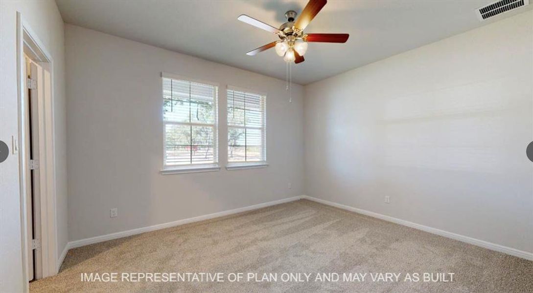 Carpeted empty room with visible vents, ceiling fan, and baseboards Carpeted empty room with visible vents, ceiling fan, and baseboards