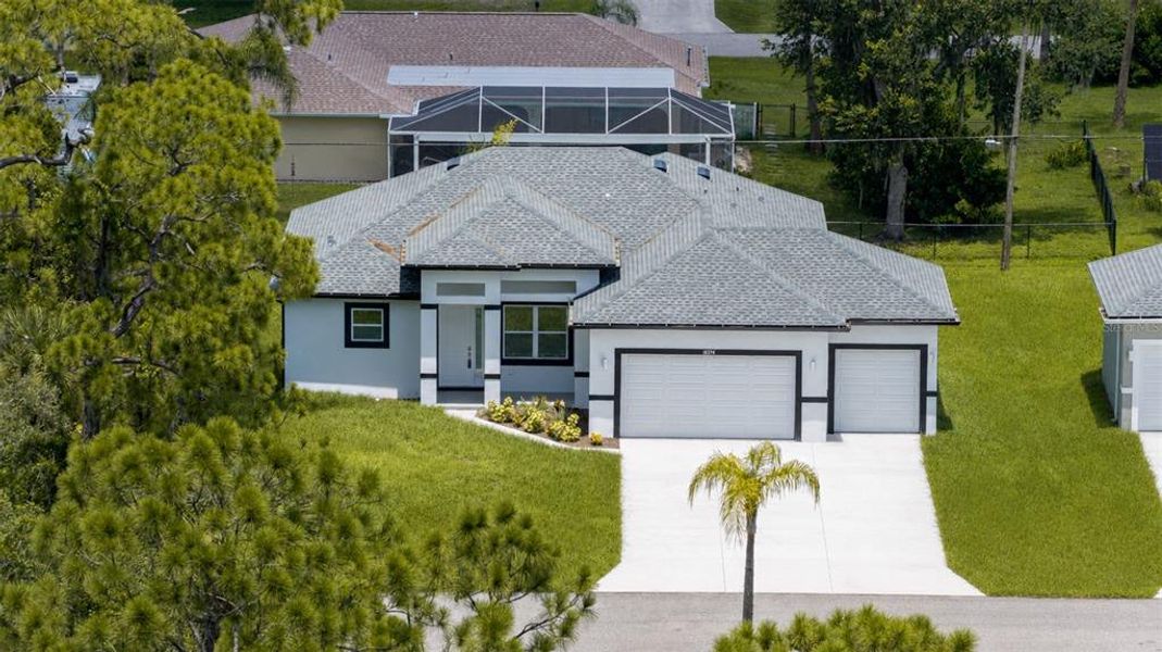 Front exterior of a new home in , Port Charlotte, FL, highlighting curb appeal (Image 31).