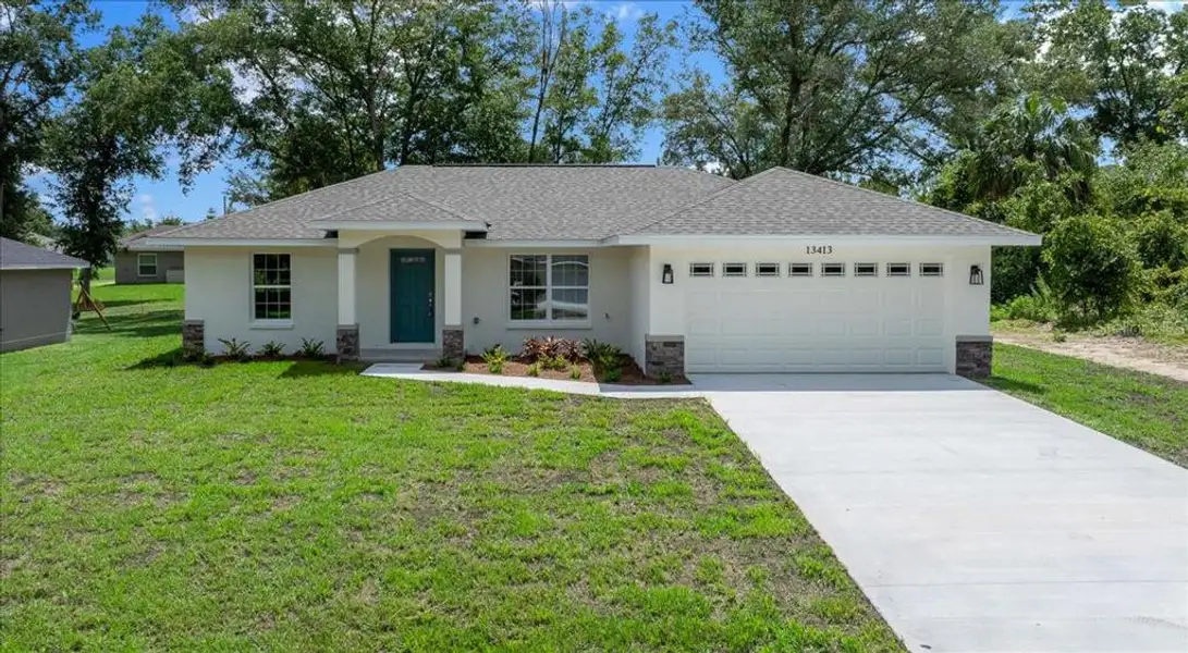 Front exterior of a new home in , Belleview, FL, highlighting curb appeal (Image 18).