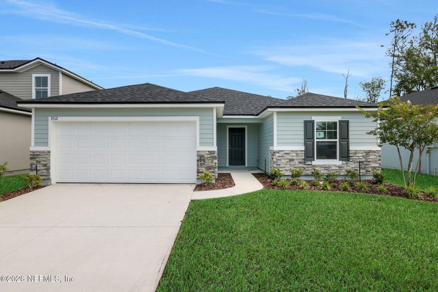 Front exterior of a new home in Wilford Oaks, Orange Park, FL, highlighting curb appeal (Image 2). Front exterior of a new home in Wilford Oaks, Orange Park, FL, highlighting curb appeal (Image 2).