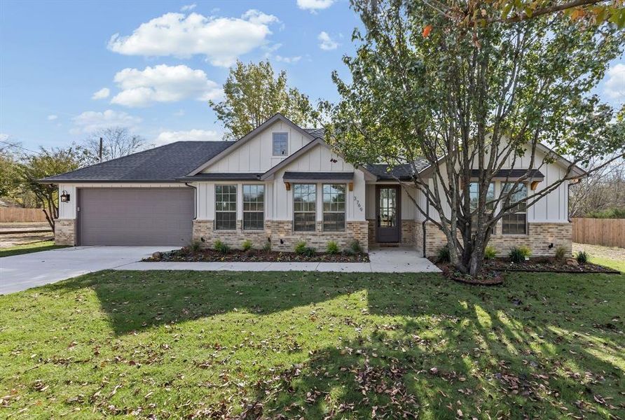 Front exterior of a new home in , Quinlan, TX, highlighting curb appeal (Image 25).