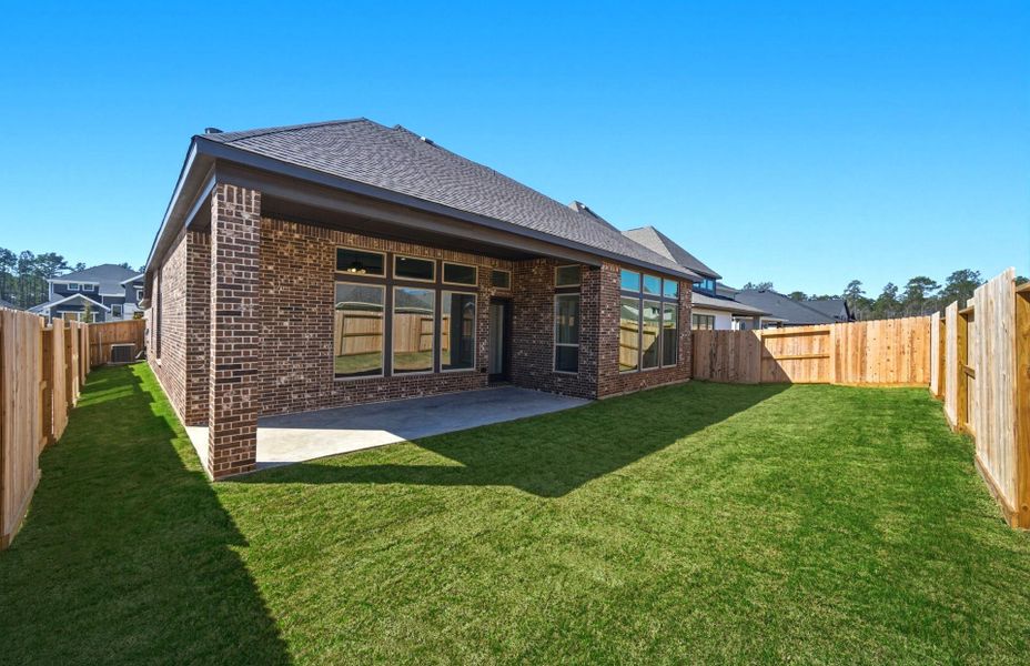 Exterior details and patio area of a home in The Highlands 55′, Porter (Image 22).