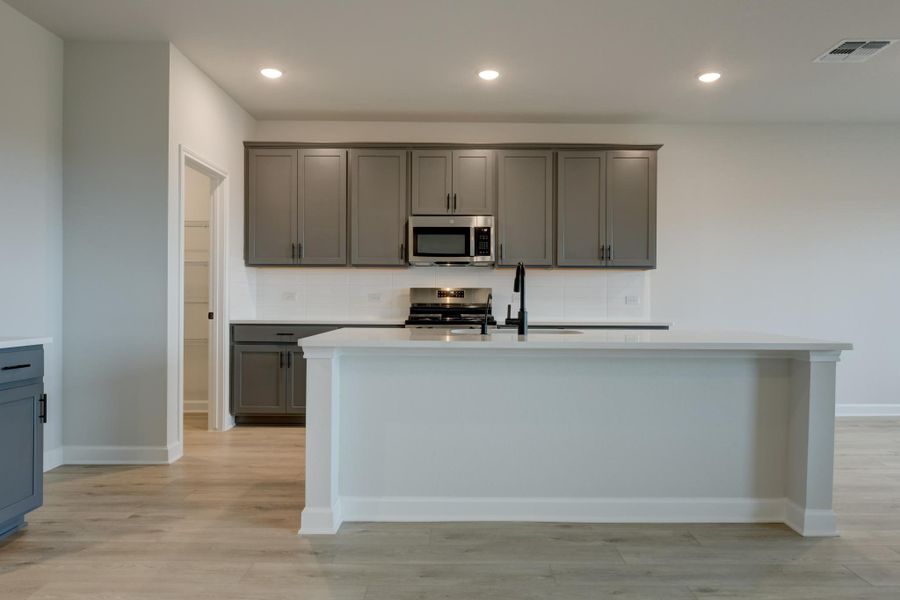 Representative furnished interior of a home built from the Jordan by Ashton Woods in Hennersby Hollow, San Antonio (Image 13).