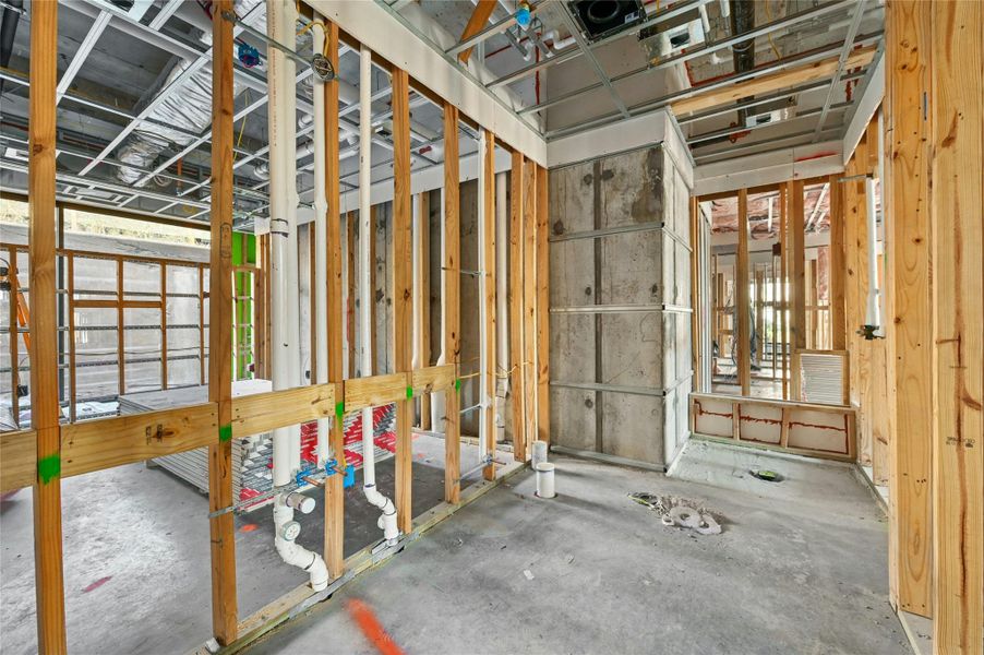 Miscellaneous room featuring unfinished concrete floors