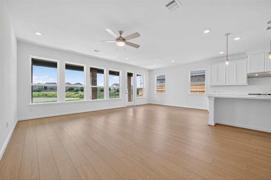 A stylish ceiling fan enhances comfort and airflow, making the living area both functional and inviting year-round.