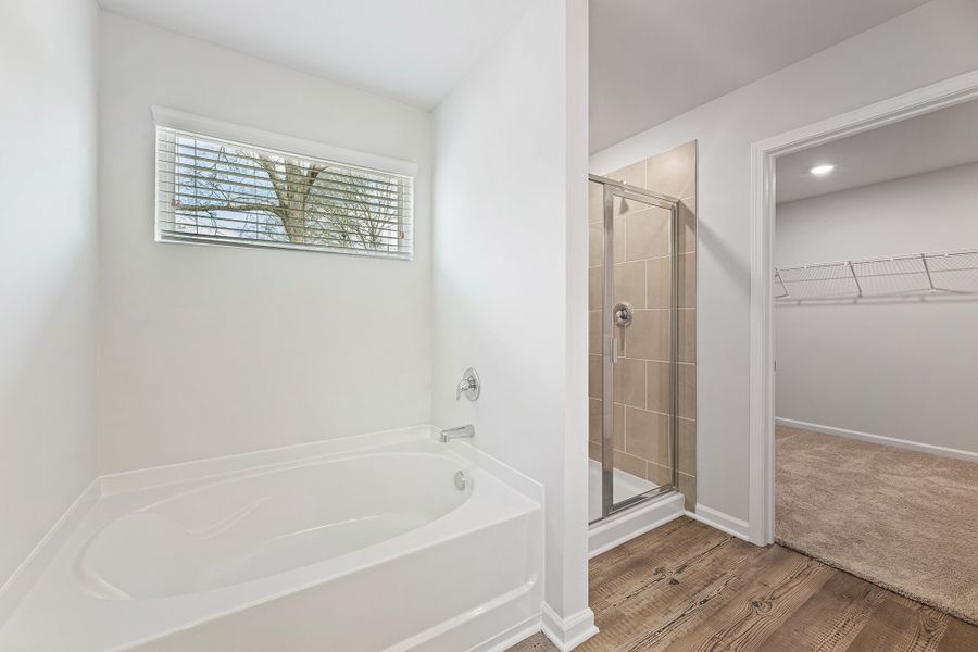 A bathroom with a glass shower. A bathroom with a glass shower.