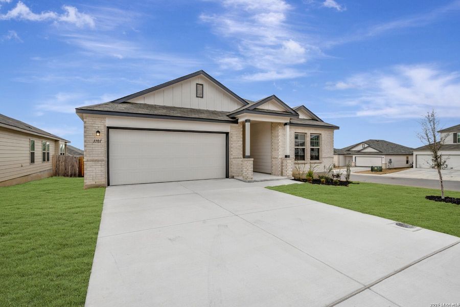 Front exterior of a new home in Greenspoint Heights, Seguin, TX, highlighting curb appeal (Image 24).