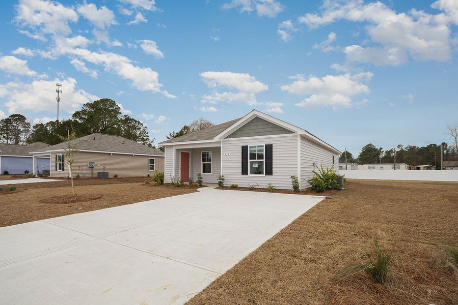 Representative exterior photo of a completed home built from the LEWIS by D.R. Horton in Cottonwood Place, Tabor City, NC (Image 12).