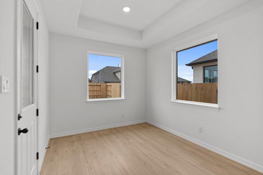 With an abundance of natural light streaming through the windows, the breakfast nook is bathed in a sunny glow, creating the perfect atmosphere to enjoy your morning coffee or a family breakfast.