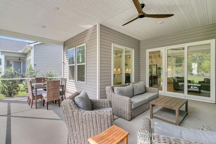 Exterior details and patio area of a home in Summerwind Crossing at Lakes of Cane Bay, Summerville (Image 3).