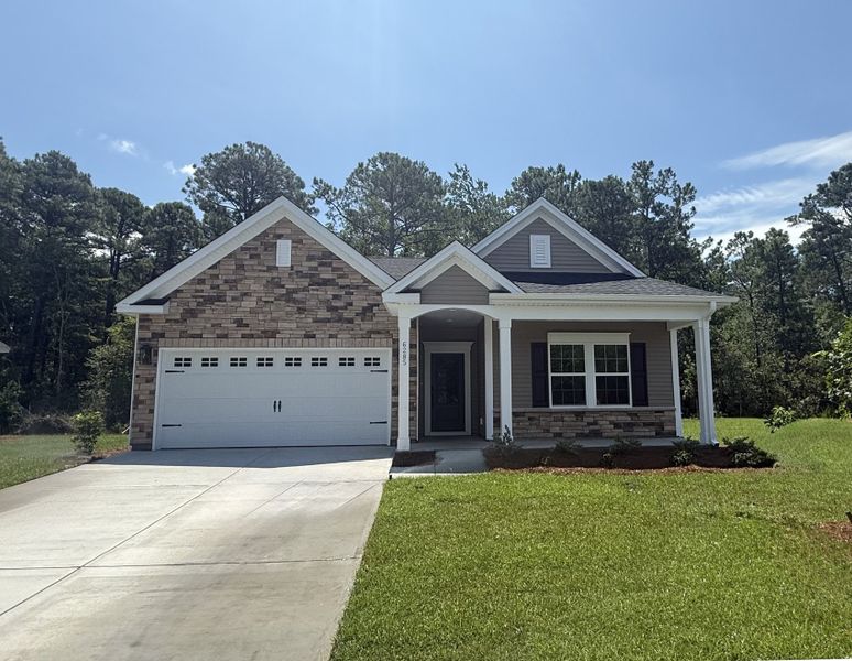 Front exterior of a new home in Arcadia, Myrtle Beach, SC, highlighting curb appeal (Image 1). Front exterior of a new home in Arcadia, Myrtle Beach, SC, highlighting curb appeal (Image 1).