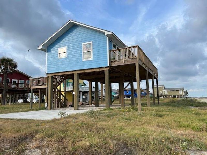 Front exterior of a new home in , Galveston, TX, highlighting curb appeal (Image 12). Front exterior of a new home in , Galveston, TX, highlighting curb appeal (Image 12).
