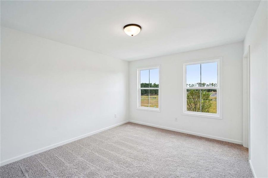 Spacious, unfurnished interior of a new home in Eastlyn Crossing, Flowery Branch (Image 26).