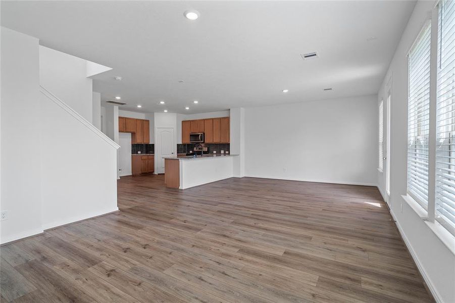 Another view of the great room looking to the kitchen and dining/breakfast areas.