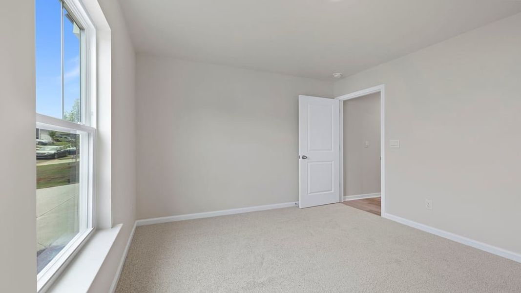 Spacious, unfurnished interior of a new home in Bentley Park, Greenwood (Image 13).