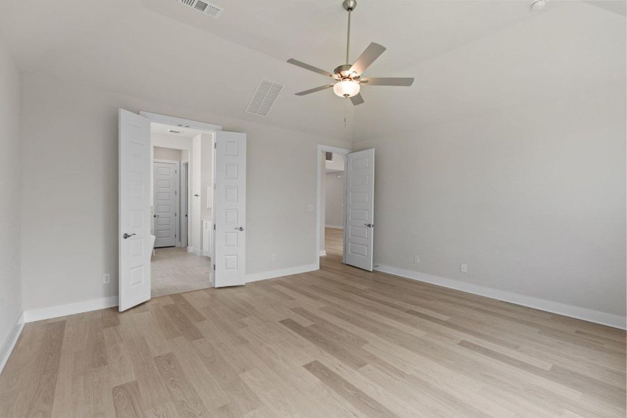 Primary Bedroom with elevated ceiling