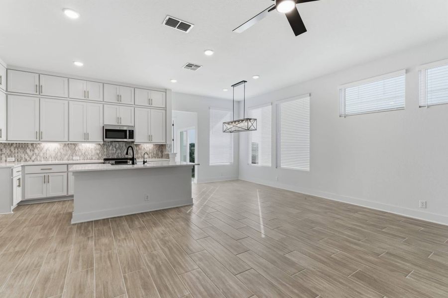 Furnished interior view inside a new home in Centero at Stone Oak, San Antonio (Image 7).