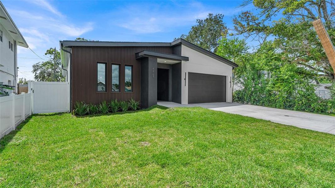 Front exterior of a new home in , St. Petersburg, FL, highlighting curb appeal (Image 25).