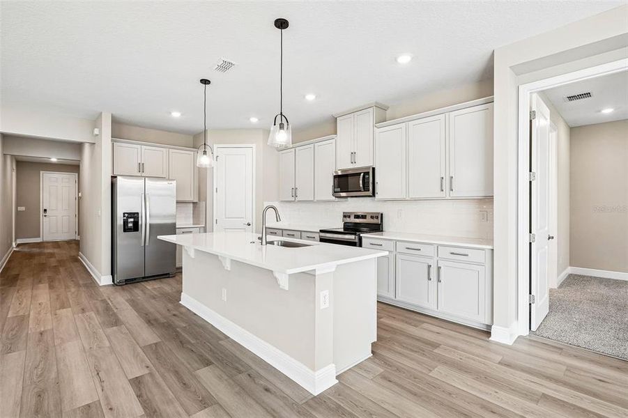 Furnished interior view inside a new home in Legends Preserve - Signature Series, Daytona Beach (Image 10).