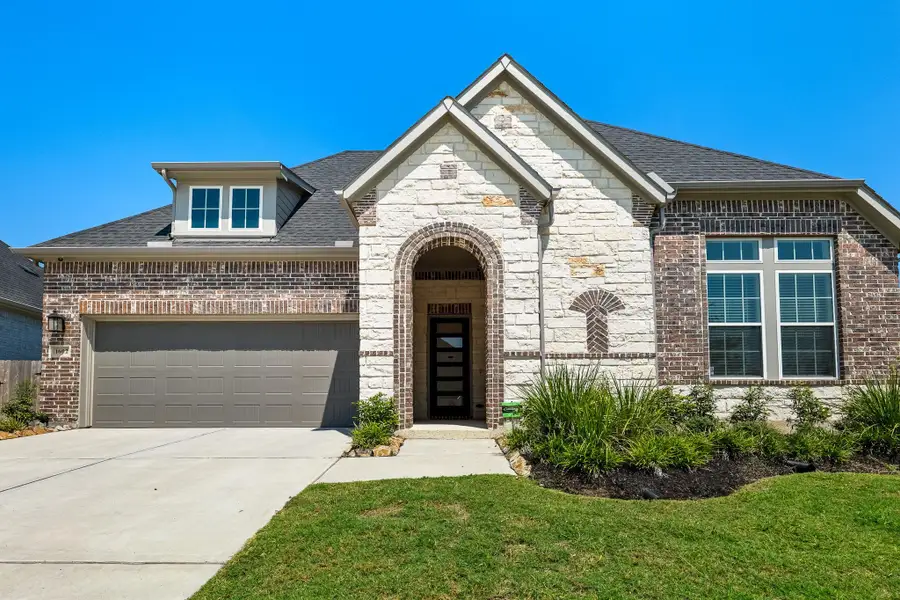 Front exterior of a new home in , Tomball, TX, highlighting curb appeal (Image 2).