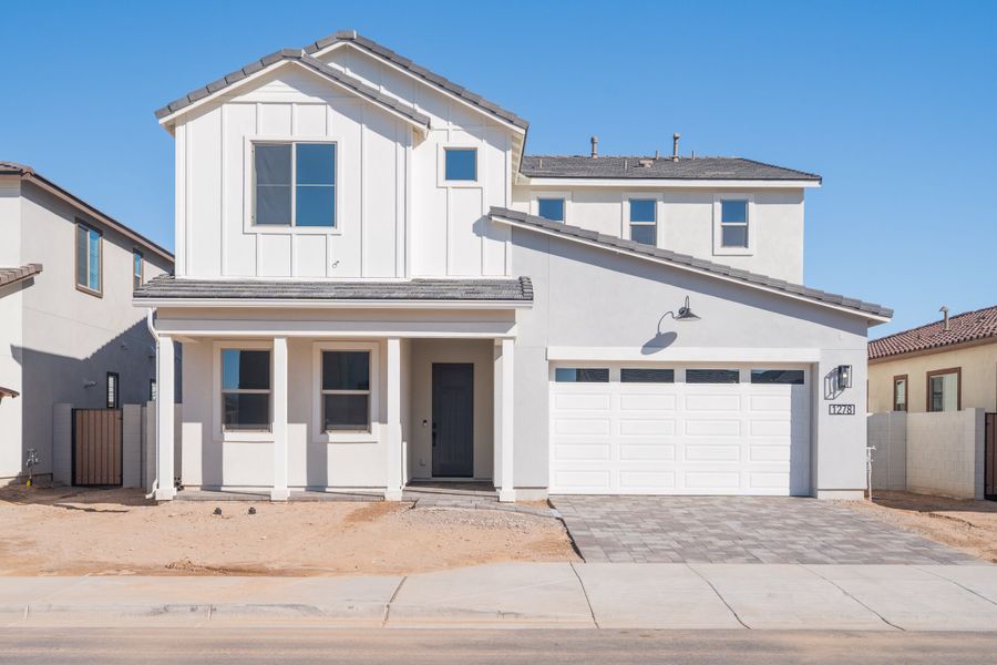Front exterior of a new home in Waterston Central, Gilbert, AZ, highlighting curb appeal (Image 1). Front exterior of a new home in Waterston Central, Gilbert, AZ, highlighting curb appeal (Image 1).