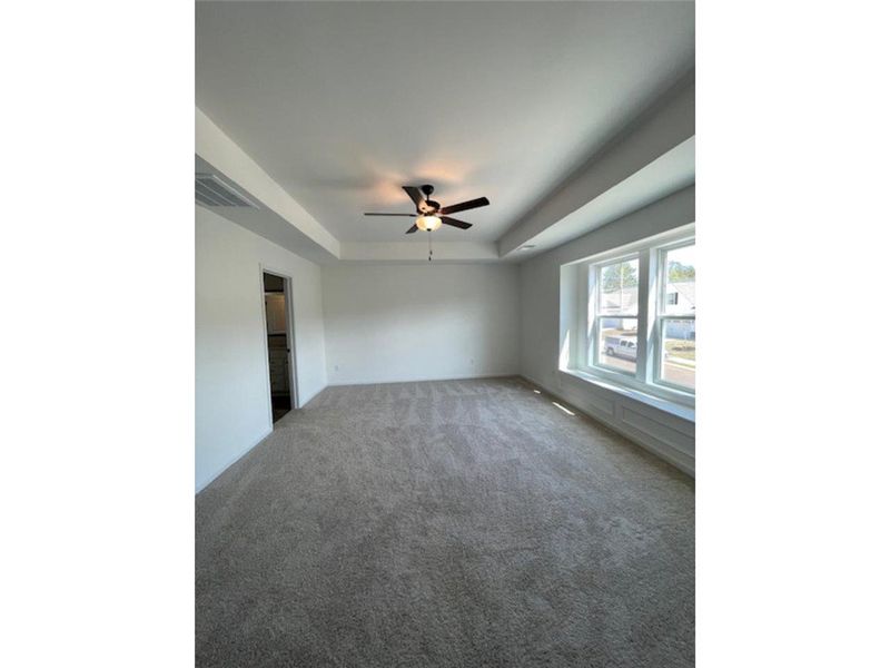 Bright and airy, this room features ample natural