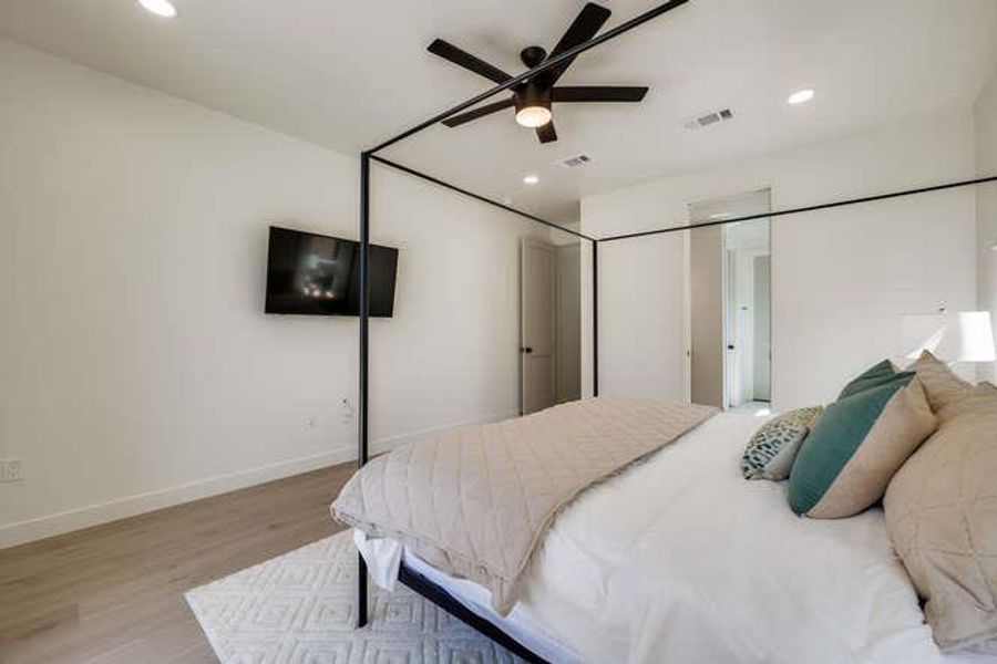 Bedroom featuring light wood-type flooring, recessed lighting, and a ceiling fan