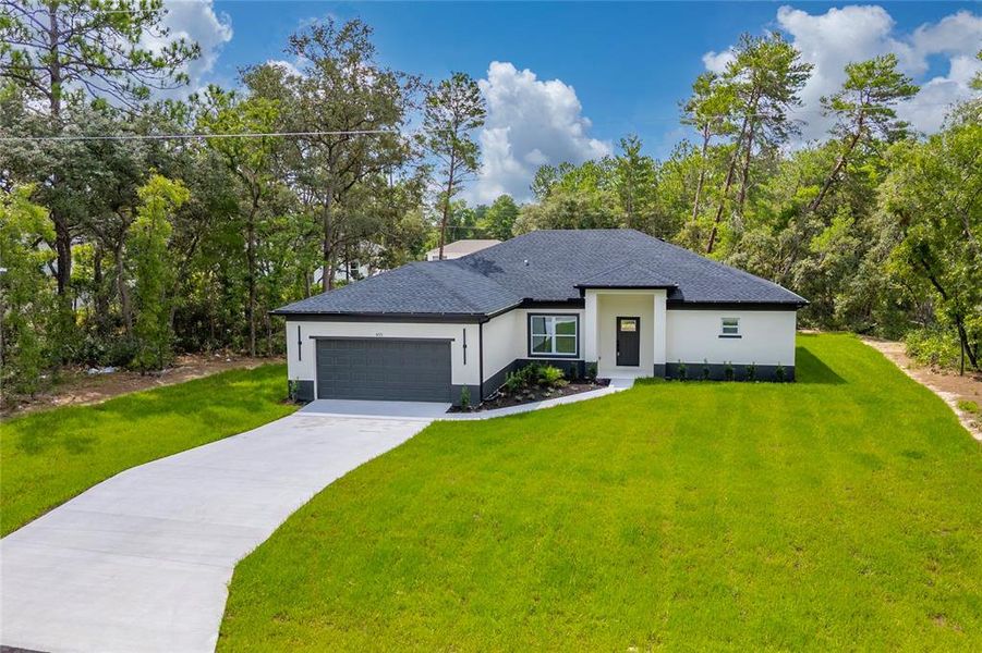 Front exterior of a new home in , Ocala, FL, highlighting curb appeal (Image 2). Front exterior of a new home in , Ocala, FL, highlighting curb appeal (Image 2).