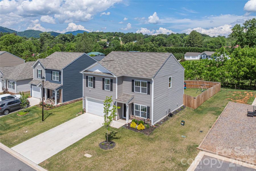 Front exterior of a new home in Patton Cove, Clyde, NC, highlighting curb appeal (Image 2).