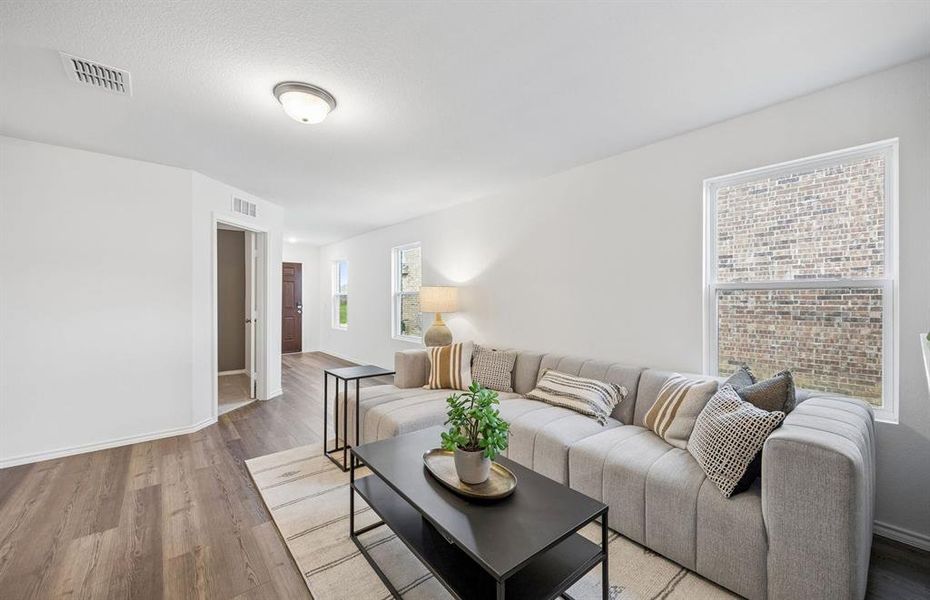 *Model Representation - Spacious gathering room with large windows