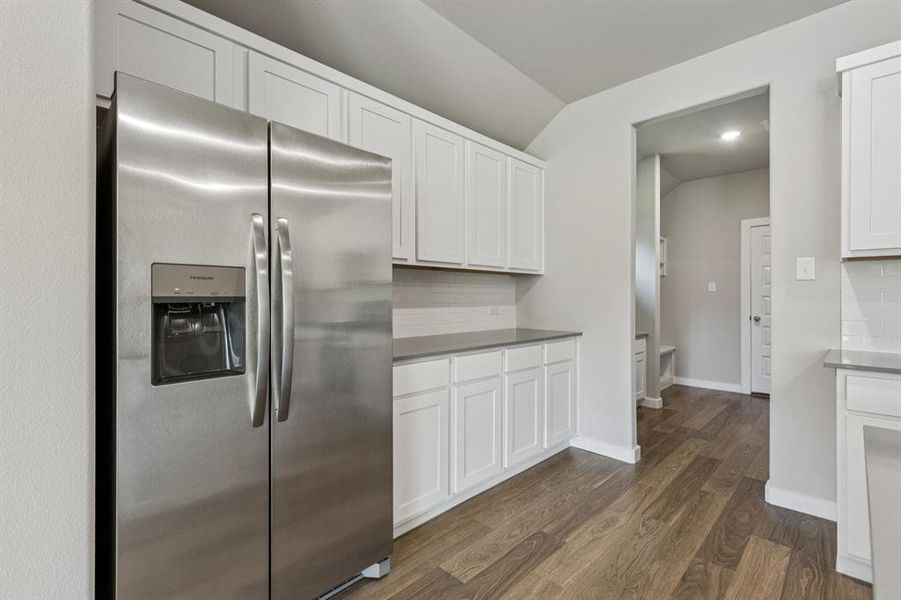 Kitchen in the Heisman home plan by Trophy Signature Homes – REPRESENTATIVE PHOTO Kitchen in the Heisman home plan by Trophy Signature Homes – REPRESENTATIVE PHOTO