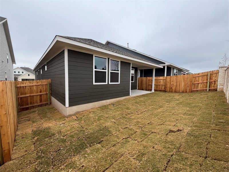 Exterior details and patio area of a home in Cannon Ranch 40s, Dripping Springs (Image 21).