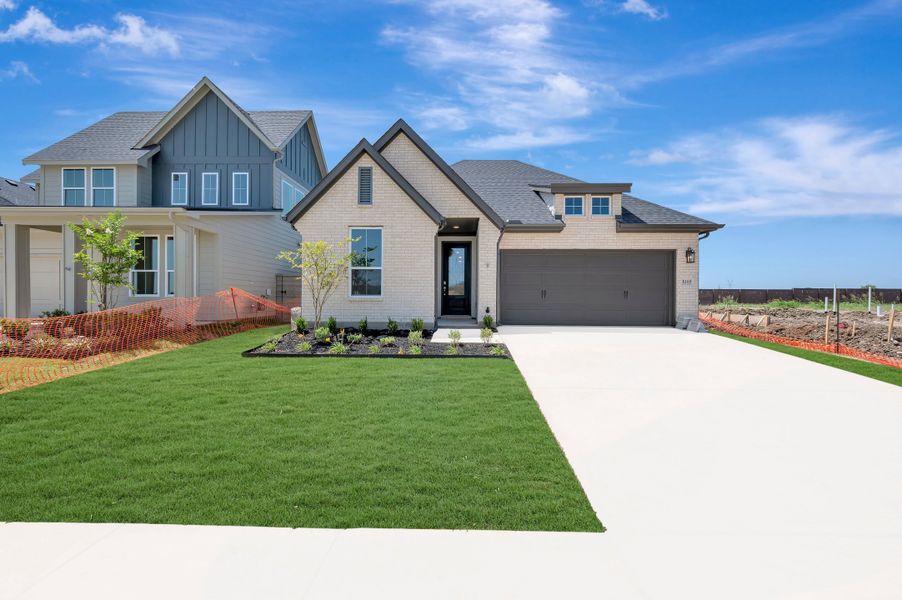 Front exterior of a new home in Landmark, Denton, TX, highlighting curb appeal (Image 1). Front exterior of a new home in Landmark, Denton, TX, highlighting curb appeal (Image 1).