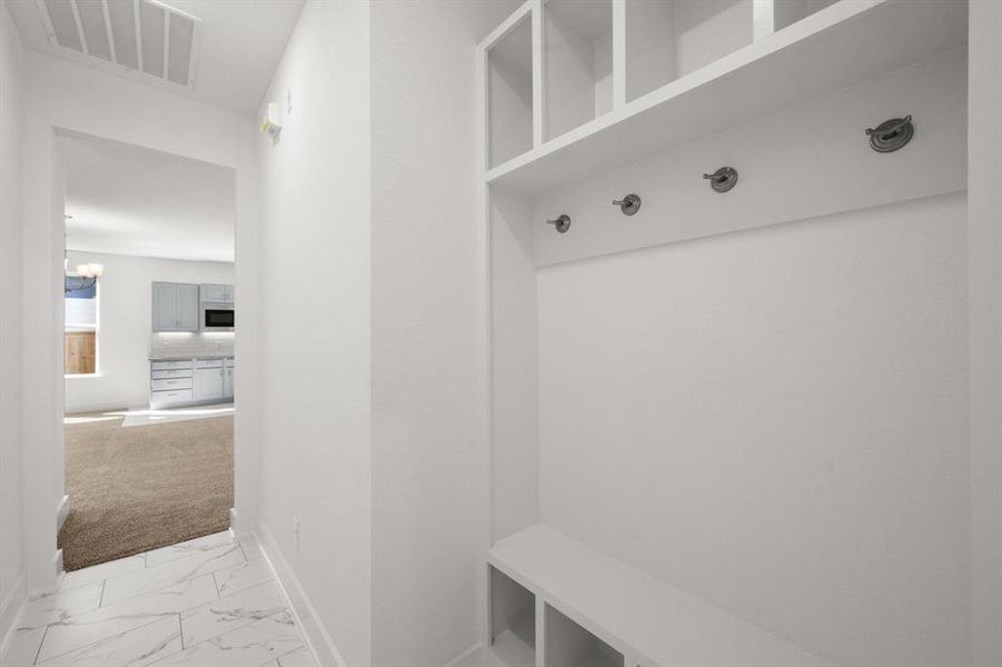 Mudroom with tile floors