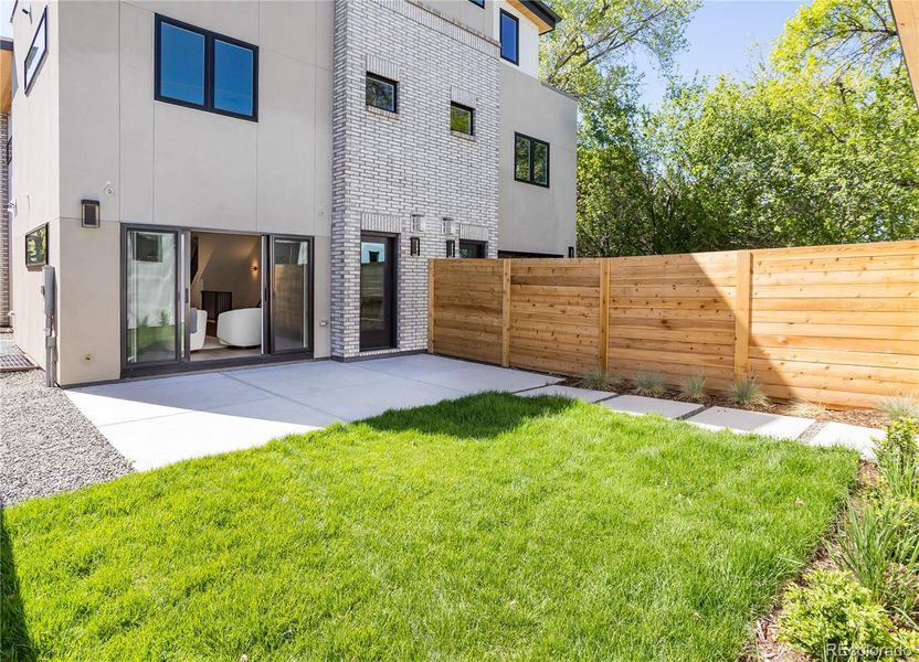 Flat back yard with new 6-ft privacy fence