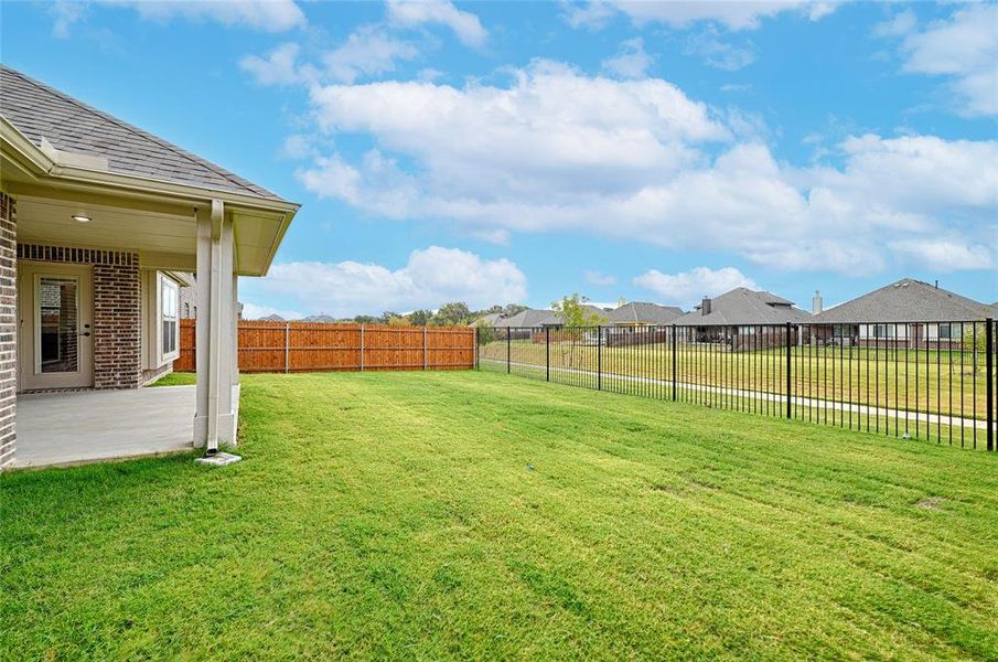 Exterior details and patio area of a home in Parks at Panchasarp Farms, Burleson (Image 25).
