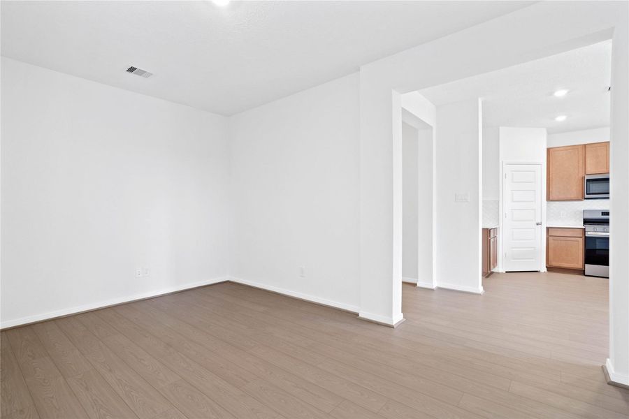 From this angle, the Den showcases its inviting openness through the wide entryway.