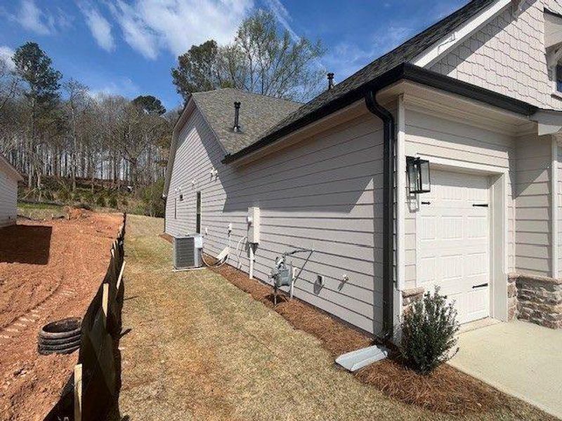 Exterior details and patio area of a home in Soleil Belmont Park, Canton (Image 10).