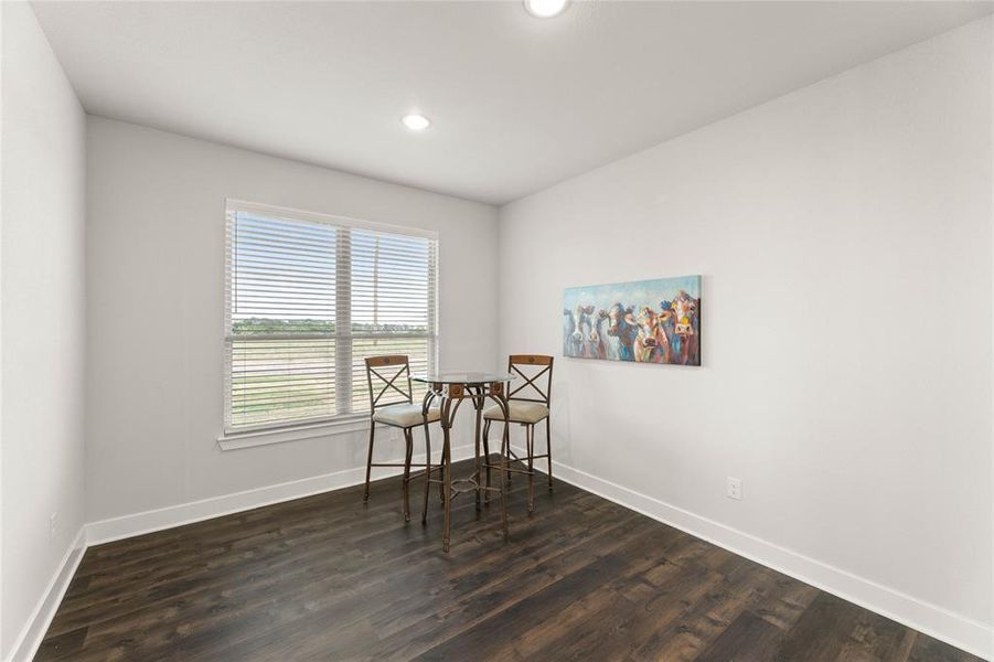 Sitting room featuring dark wood finished floors and recessed lighting Sitting room featuring dark wood finished floors and recessed lighting
