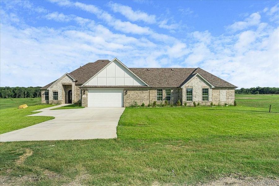 Front exterior of a new home in , Corsicana, TX, highlighting curb appeal (Image 2). Front exterior of a new home in , Corsicana, TX, highlighting curb appeal (Image 2).