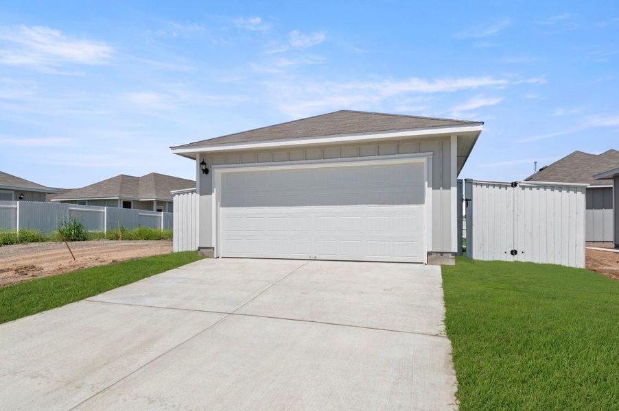 Front exterior of a new home in Casetta Ranch, Kyle, TX, highlighting curb appeal (Image 22).