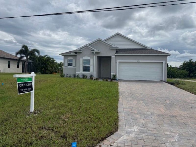 Front exterior of a new home in Cape Coral, Cape Coral, FL, highlighting curb appeal (Image 2). Front exterior of a new home in Cape Coral, Cape Coral, FL, highlighting curb appeal (Image 2).
