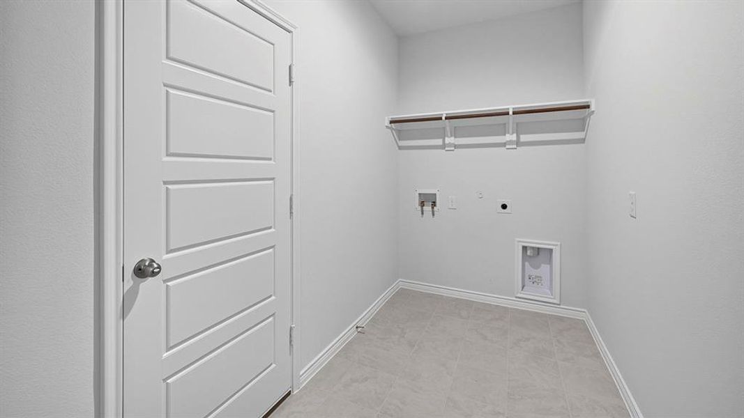 Laundry room with hookup for an electric dryer and hookup for a washing machine