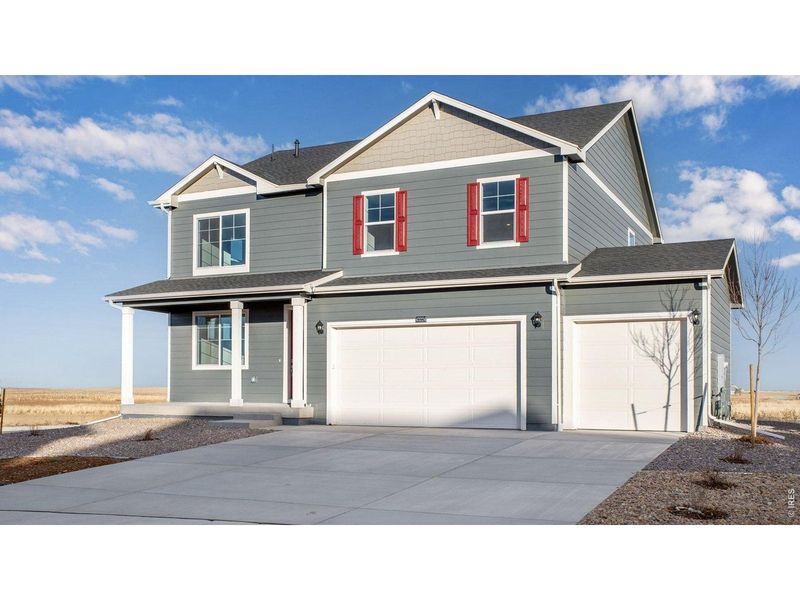Front exterior of a new home in Vantage, Berthoud, CO, highlighting curb appeal (Image 1). Front exterior of a new home in Vantage, Berthoud, CO, highlighting curb appeal (Image 1).