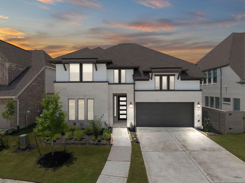 Front exterior of a new home in Legacy, League City, TX, highlighting curb appeal (Image 1). Front exterior of a new home in Legacy, League City, TX, highlighting curb appeal (Image 1).