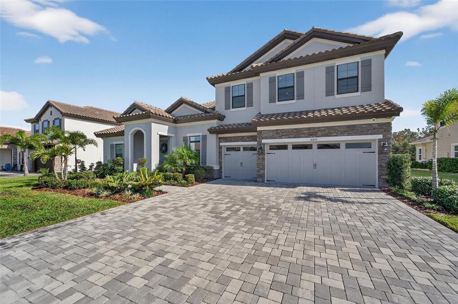 Front exterior of a new home in Creek Ridge Preserve, Lithia, FL, highlighting curb appeal (Image 27). Front exterior of a new home in Creek Ridge Preserve, Lithia, FL, highlighting curb appeal (Image 27).