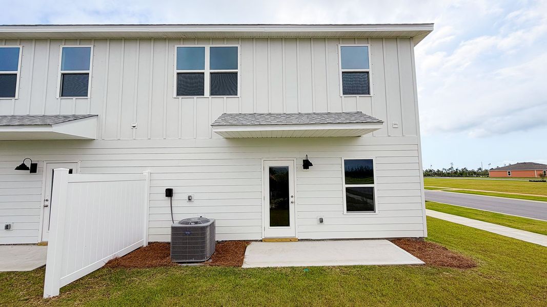 Exterior details and patio area of a home in Salt Creek Townhomes at Mexico Beach, Mexico Beach (Image 4).
