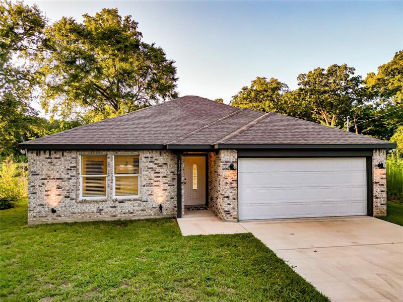 Ranch-style home featuring brick siding and a front yard Ranch-style home featuring brick siding and a front yard