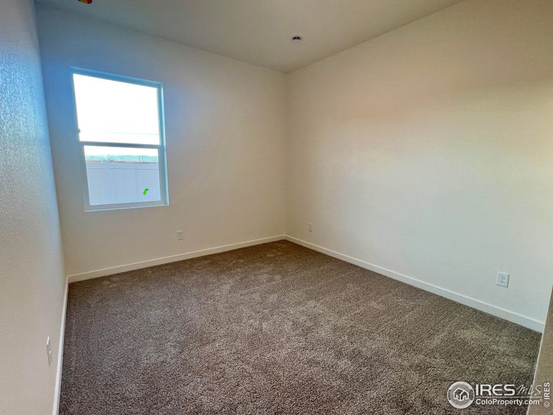 Spacious, unfurnished interior of a new home in Union Colony West, Greeley (Image 15).