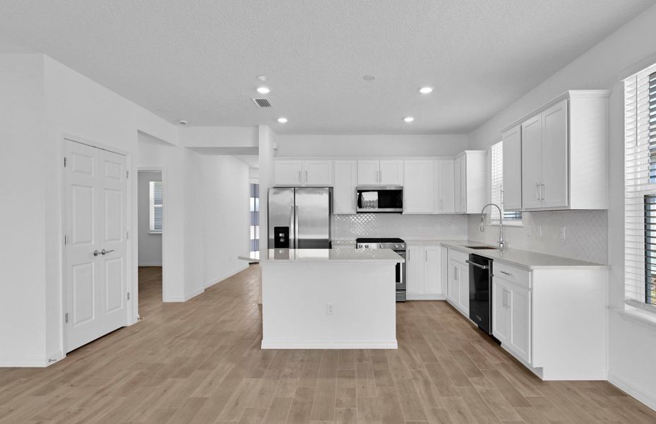 Furnished interior view inside a new home in Del Webb Wildlight, Yulee (Image 8).